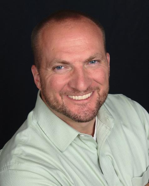 Headshot of actor and baritone August Stoten